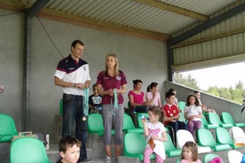 County Hurling/Camogie players Cyril Donnellan and Niamh Kilkenny prepare to present the medals.