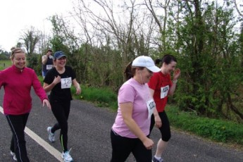 Some of the runners on route to the start line. Julie Anne Reilly (on left) seems happy...