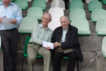 TJ Beatty, Loughrea AC presented with the prize in his age category